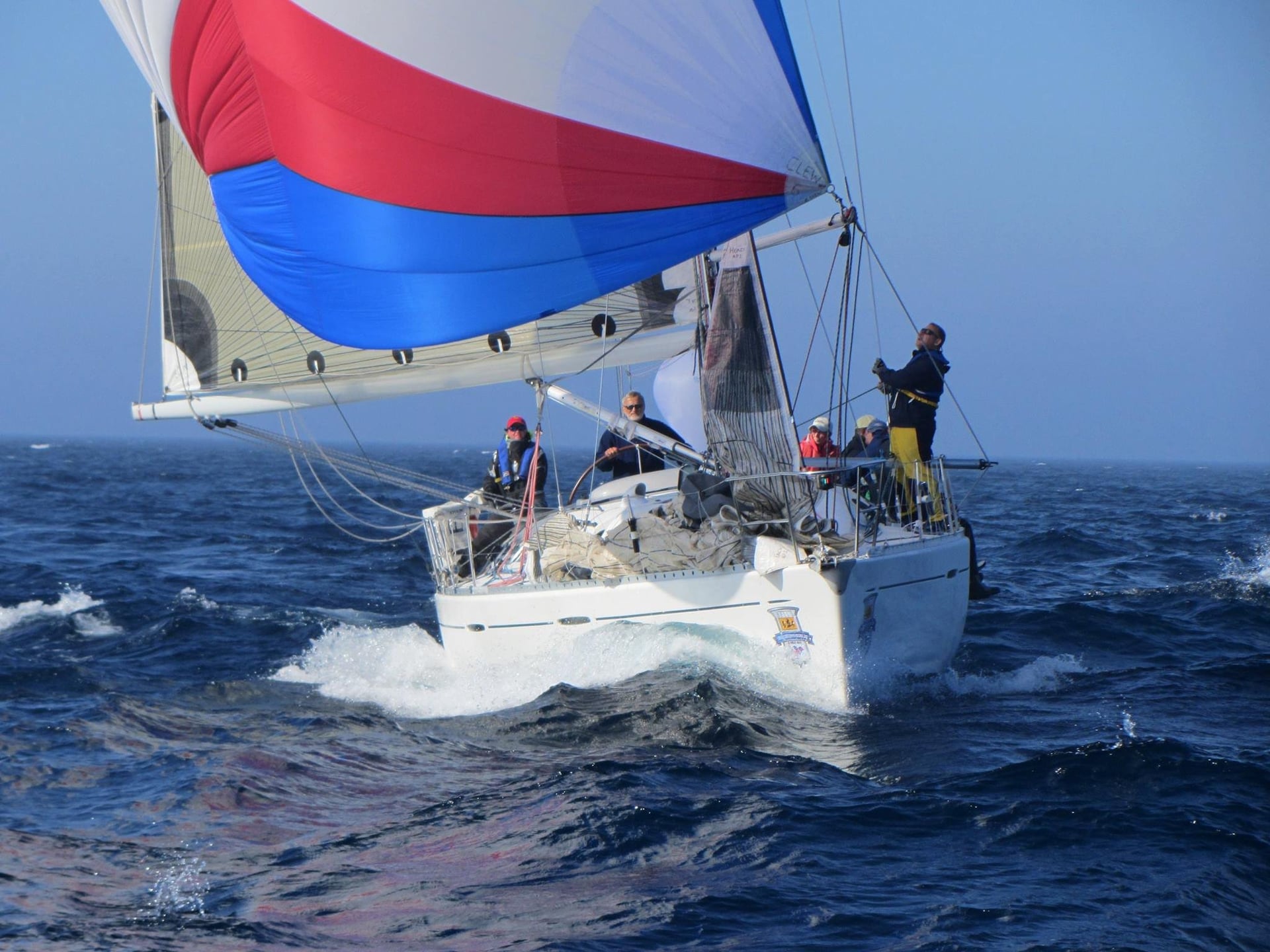 Sailboat with colorful spinnaker sails