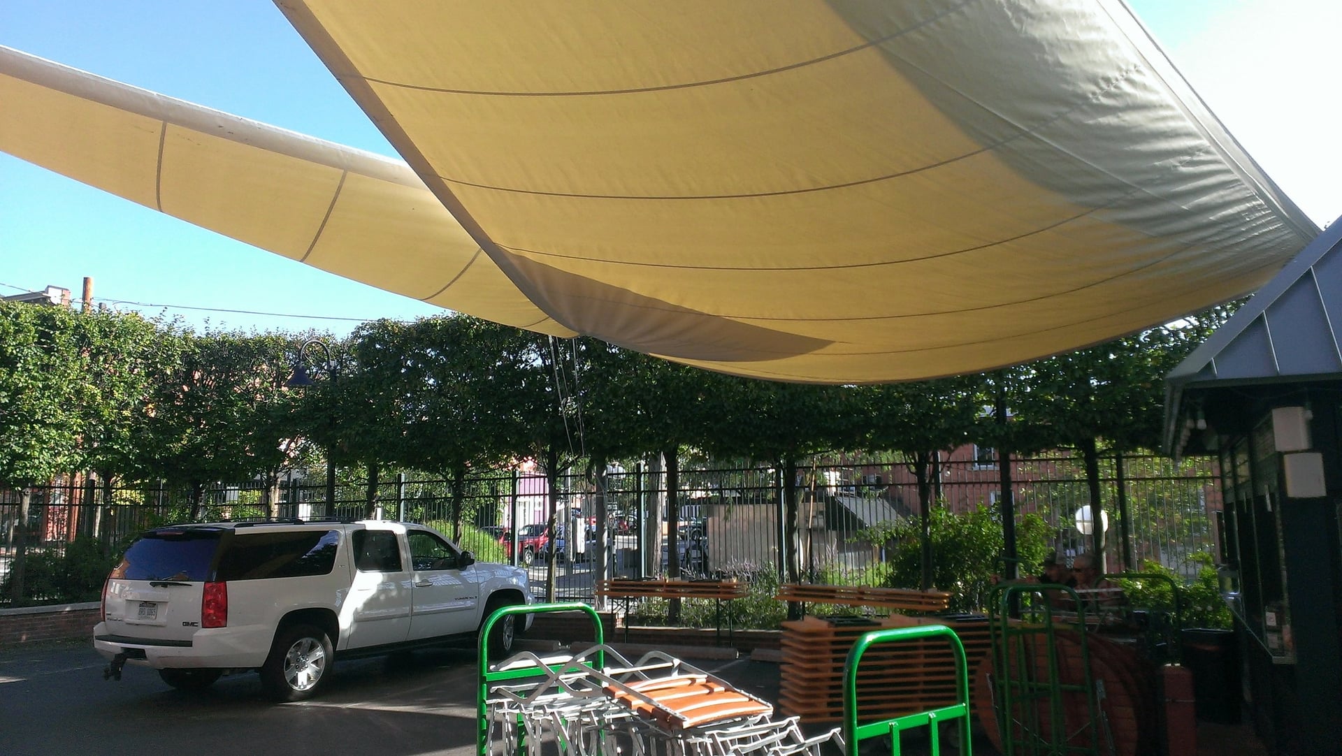 SUV parked under a sunshade structure