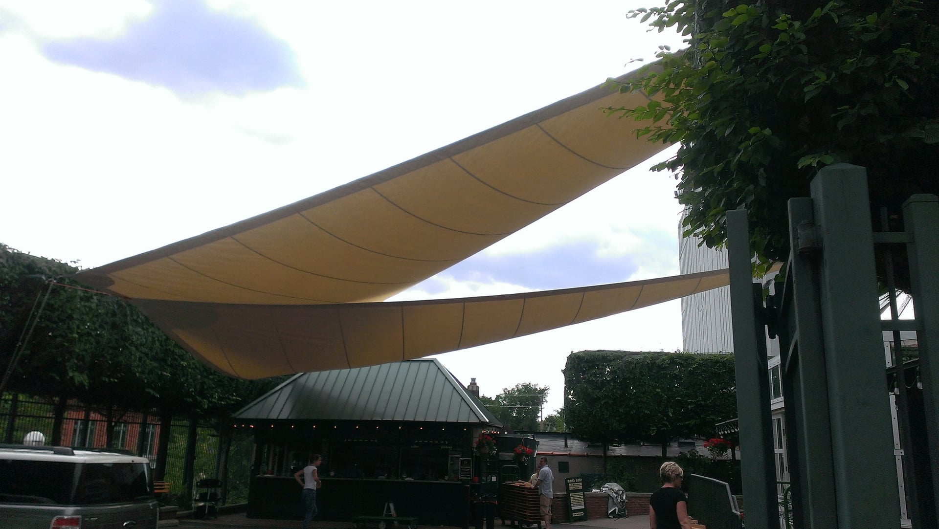 Outdoor patio with a yellow sail shade