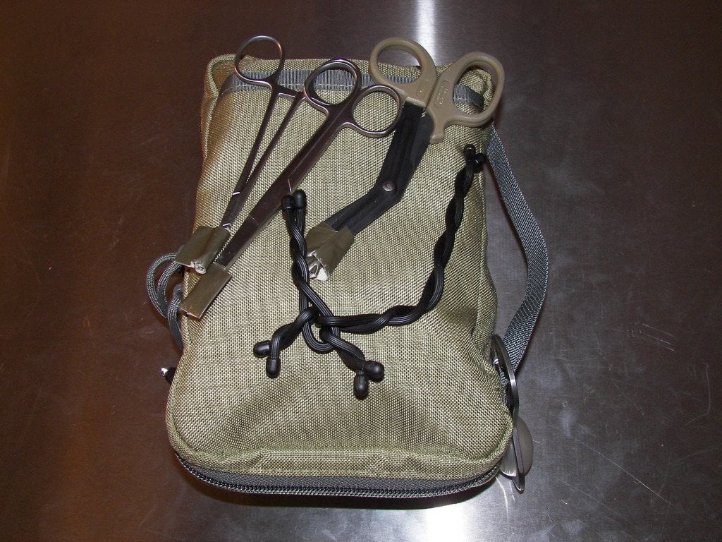 Tactical medical kit with scissors and forceps