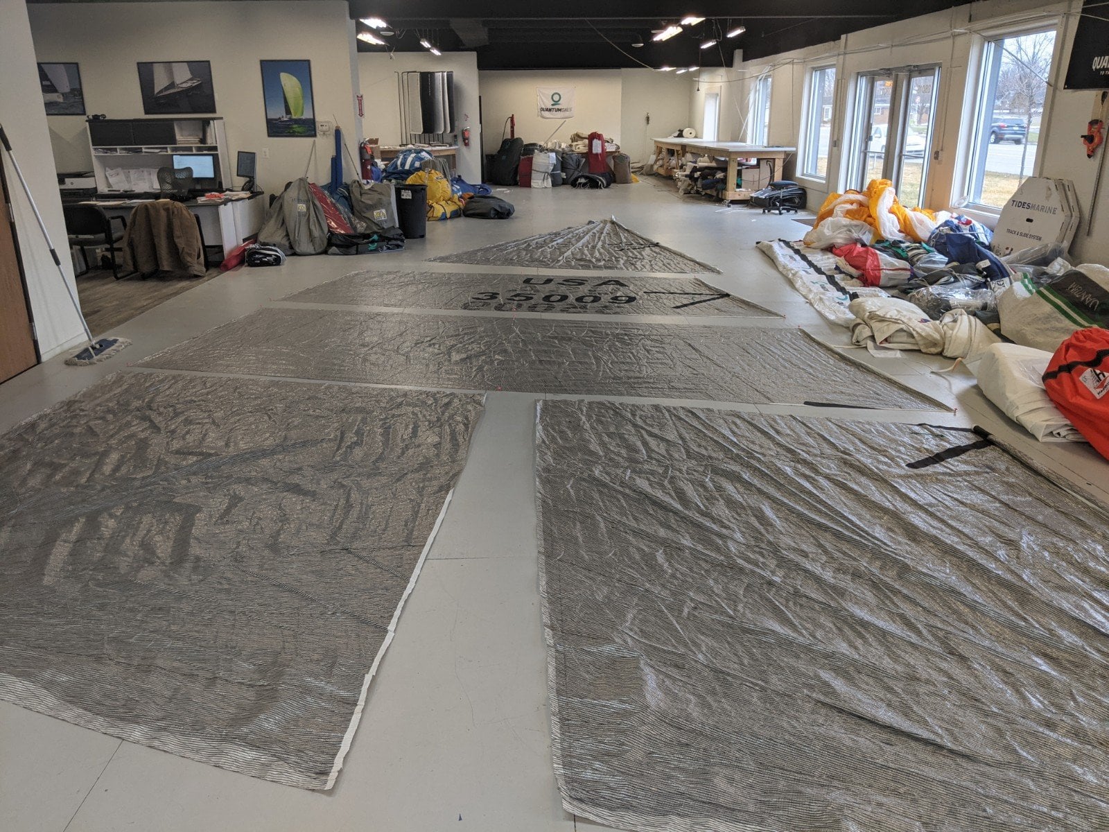 Sail loft floor with sails laid out for repair