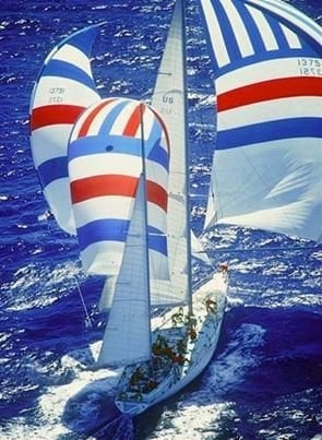 Sailboat with colorful striped sails